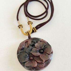 Garnet with Astrophyllite Flowers Pendant with Necklace Cord
Natural Crystal